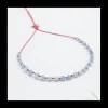 BLUE STORM - BRACELET EN APATITES BLEUES CUBES SUR CORDON NOUÉ